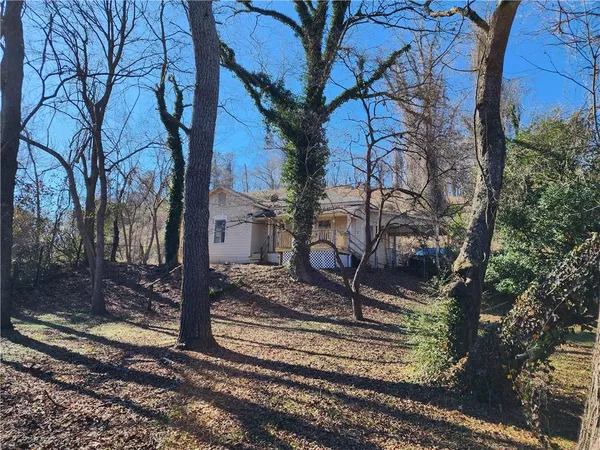 a view of a backyard of the house