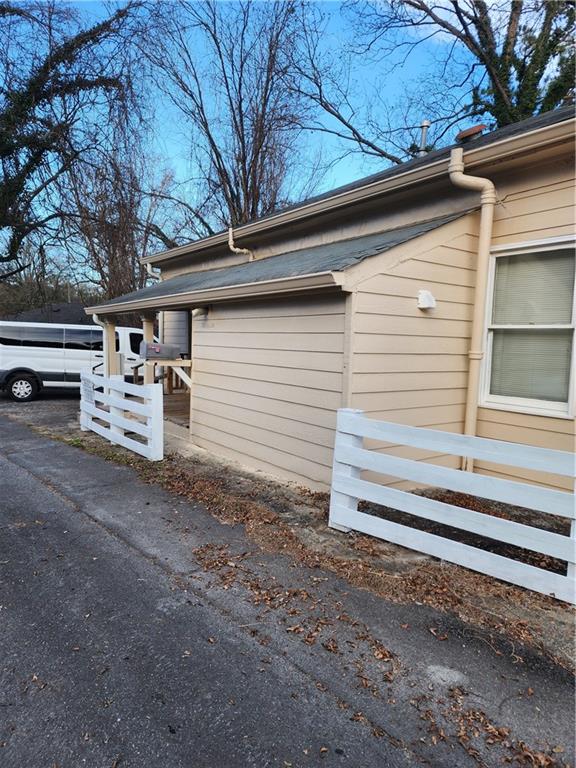200 Cave Spring Street Southwest Rome, GA 30161 - Photo 15 of 16 a view of a house with a yard and large tree