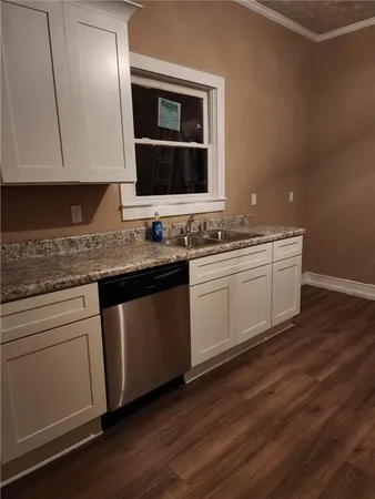 a kitchen with a sink and cabinets