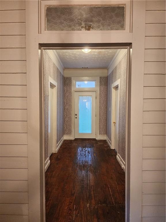 200 Cave Spring Street Southwest Rome, GA 30161 - Photo 7 of 16 a view of a hallway with wooden floor and a bathroom