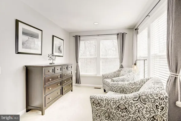 a bedroom with furniture and windows