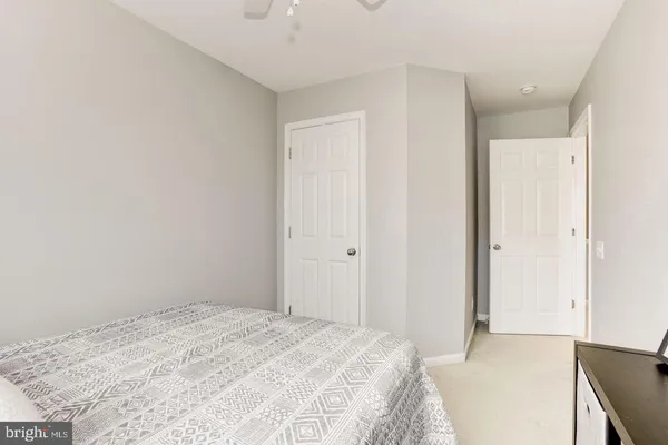a bedroom with a bed and a cabinets