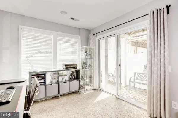 a view of front door with outdoor living space