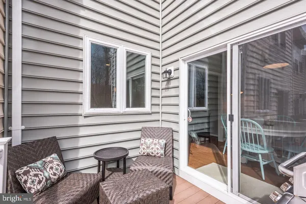 a view of a patio with two couches and deck