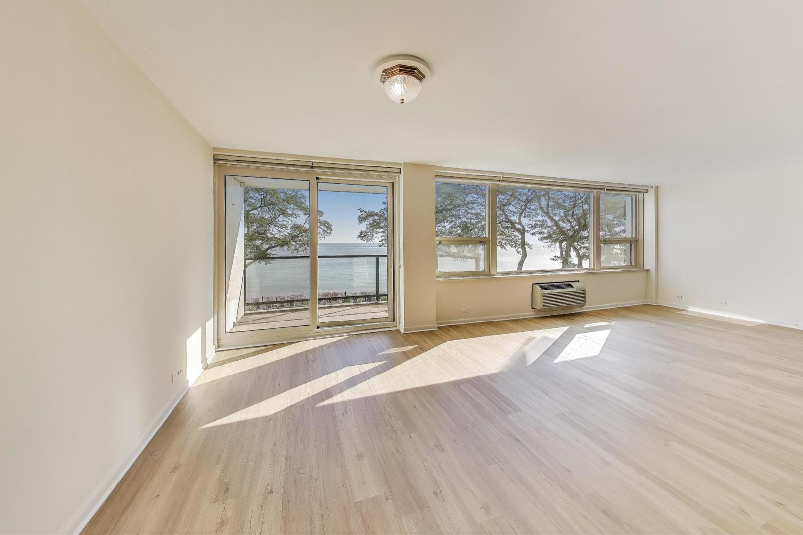 1630 Sheridan Road, Unit 2J Wilmette, IL 60091 - Photo 11 of 50 an empty room with wooden floor and windows