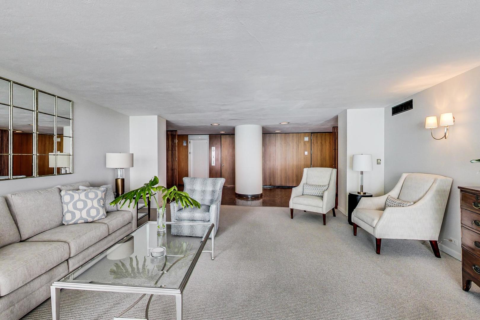 1630 Sheridan Road, Unit 2J Wilmette, IL 60091 - Photo 30 of 50 a living room with furniture and wooden floor