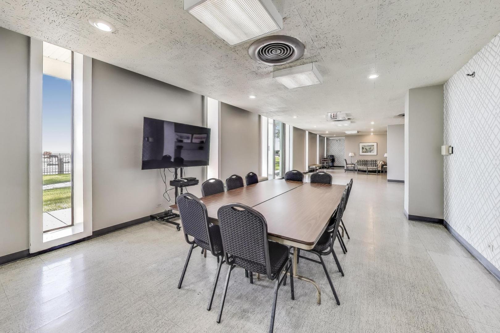 1630 Sheridan Road, Unit 2J Wilmette, IL 60091 - Photo 35 of 50 a view of a dining room with furniture and a table