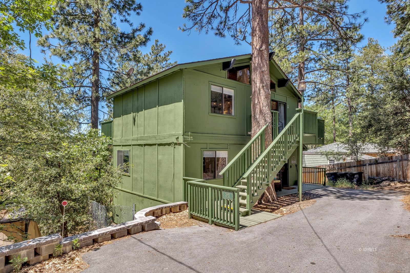 25595 Glen Road Idyllwild, CA 92549 - Photo 5 of 51 a view of a house with a wooden deck
