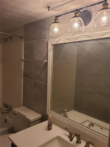a bathroom with a sink and shower