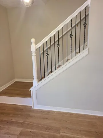 a view of staircase with wooden floor