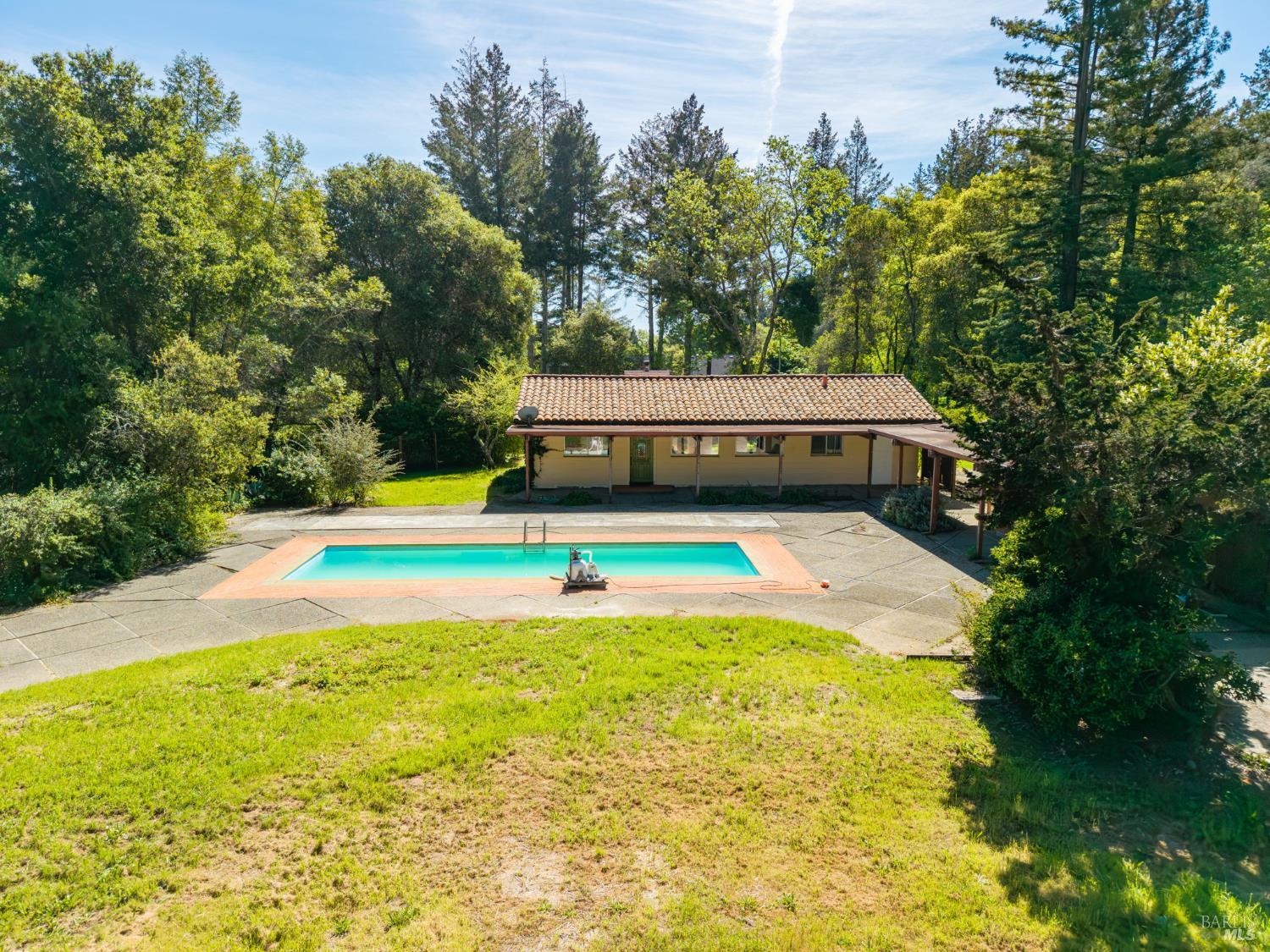 3320 Redwood Road Napa, CA 94558 - Photo 4 of 57 a view of a swimming pool with an outdoor space and seating area