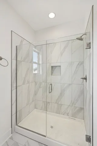 a bathroom with a shower and a bathtub