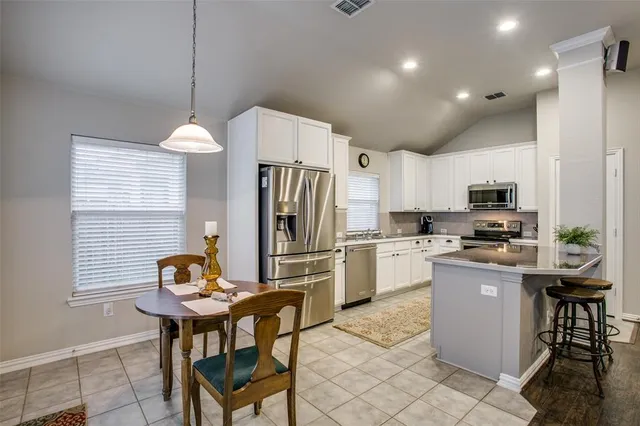 a bed room with a bed and a lamp