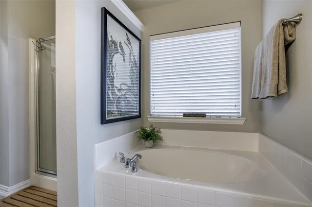 a view of a backyard with wooden fence