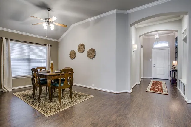 a view of a workspace with furniture and wooden floor