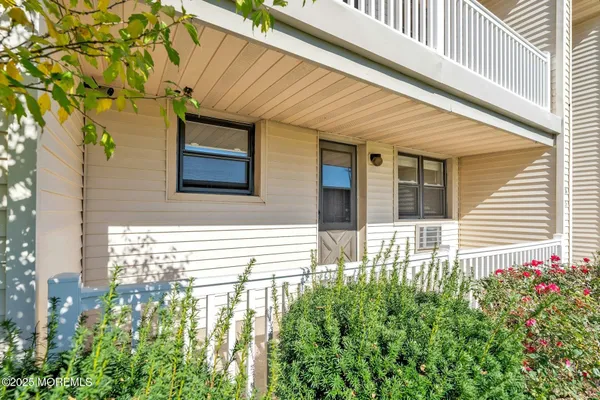 a view of a house with a flower garden