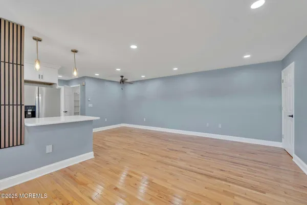 a view of kitchen with wooden floor