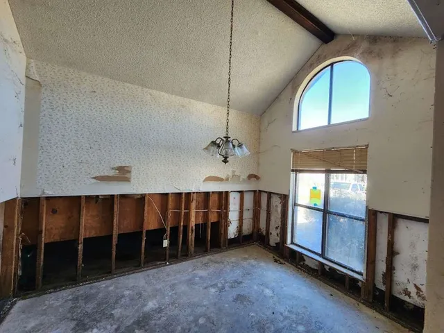 an empty room with windows