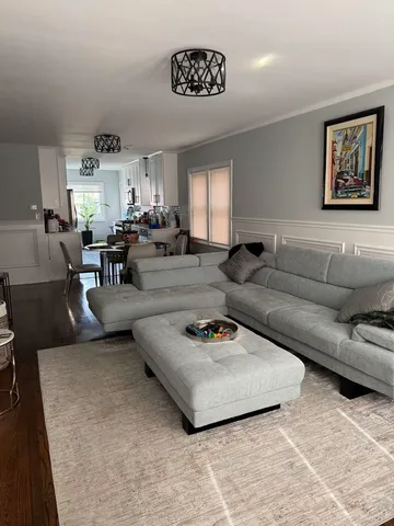 a living room with furniture and a table