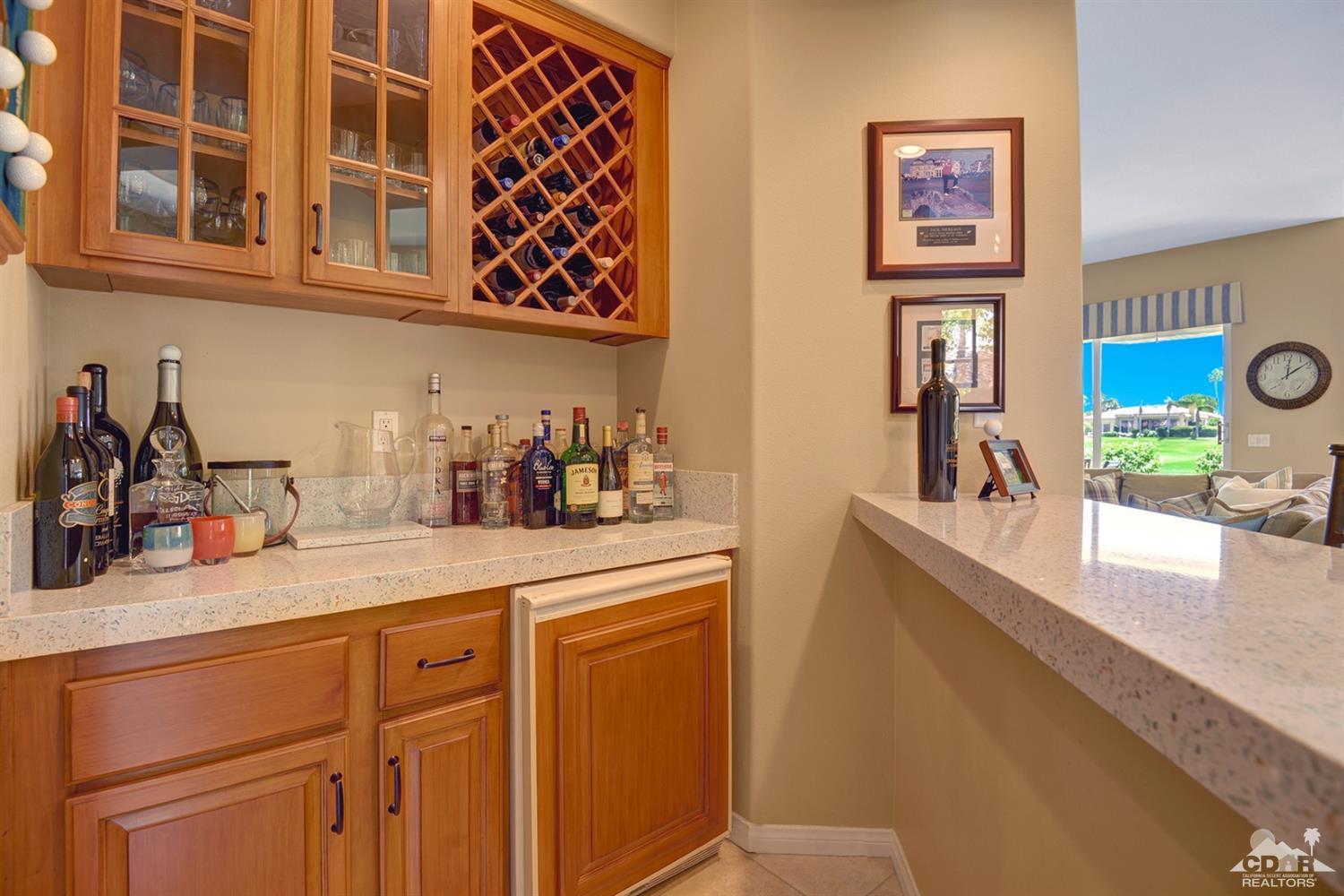 79675 Cetrino La Quinta, CA 92253 - Photo 11 of 34 a kitchen with stainless steel appliances granite countertop a sink and a white cabinets