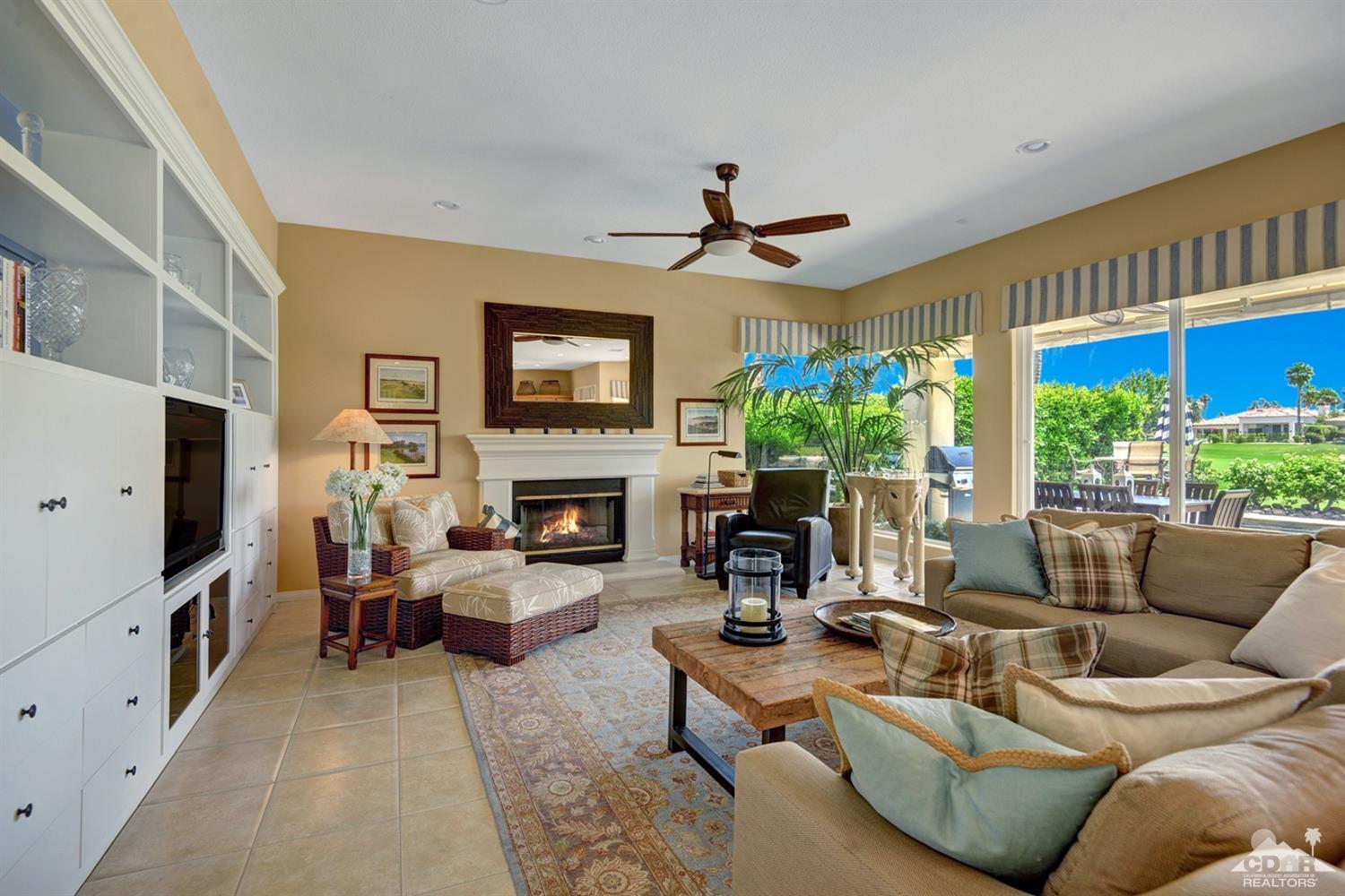 79675 Cetrino La Quinta, CA 92253 - Photo 16 of 34 a living room with furniture a flat screen tv and a fireplace