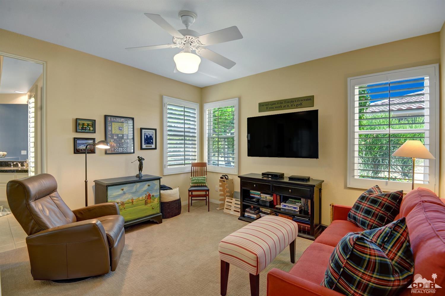 79675 Cetrino La Quinta, CA 92253 - Photo 24 of 34 a living room with furniture and a flat screen tv