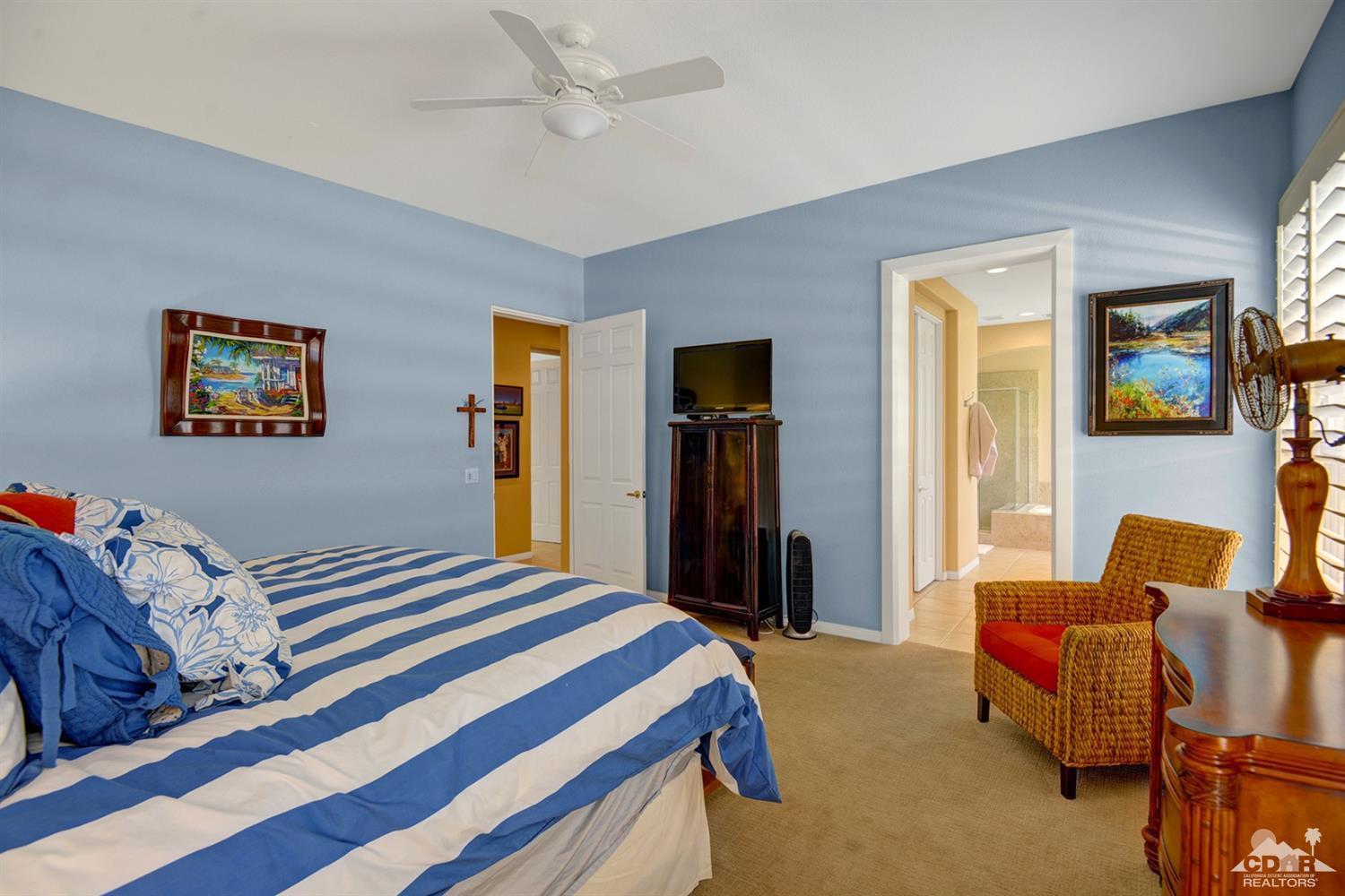 79675 Cetrino La Quinta, CA 92253 - Photo 29 of 34 a bedroom with bed and a couch
