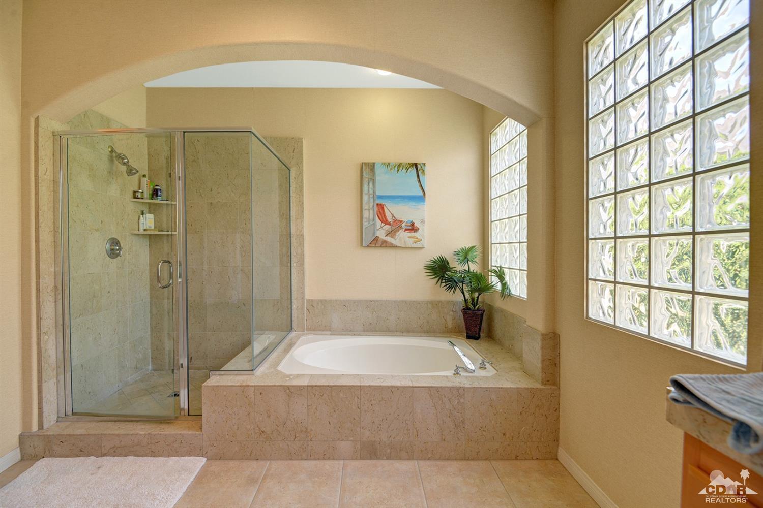 79675 Cetrino La Quinta, CA 92253 - Photo 31 of 34 a spacious bathroom with a tub shower and window