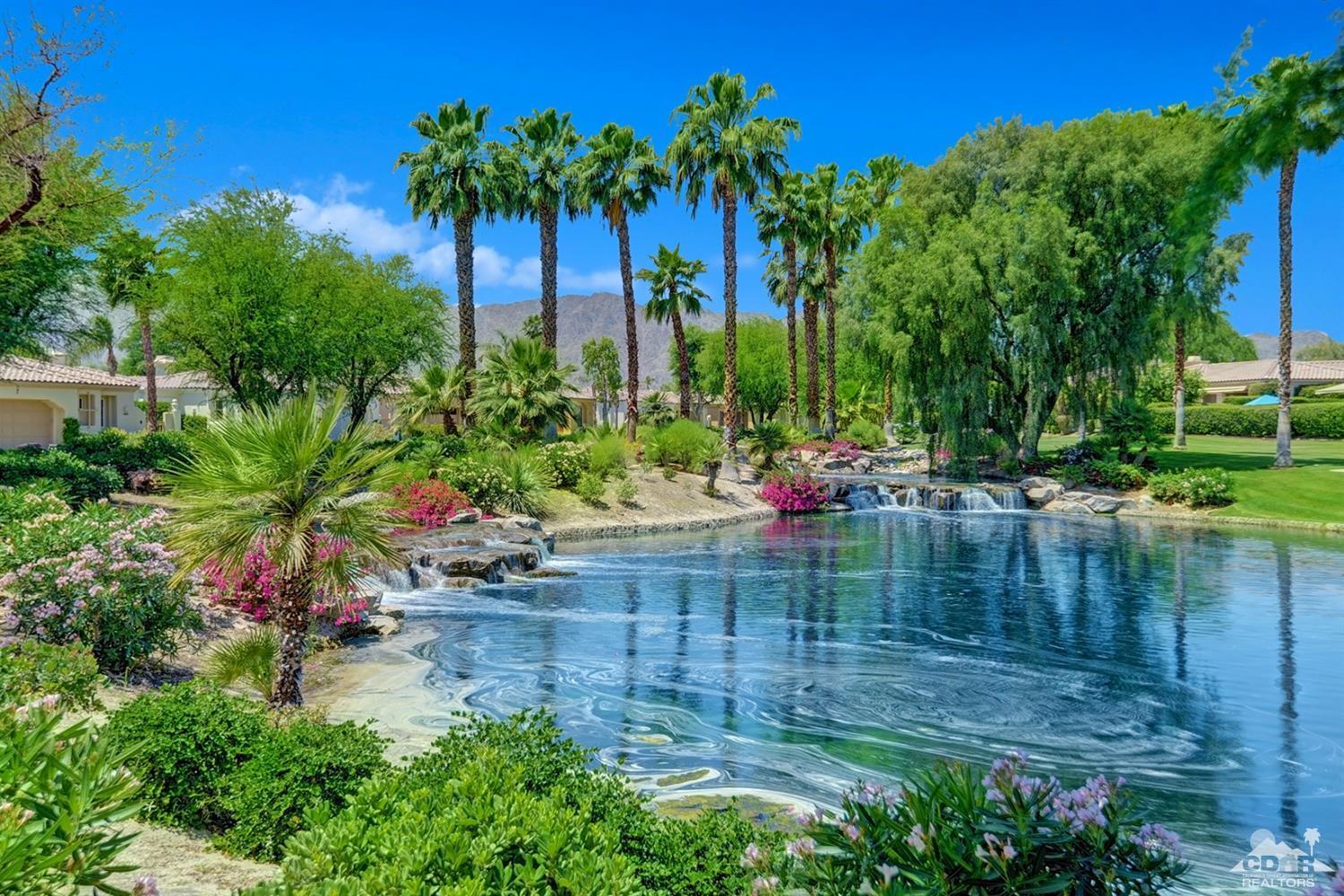 79675 Cetrino La Quinta, CA 92253 - Photo 32 of 34 a backyard of a house with lots of green space and lake view