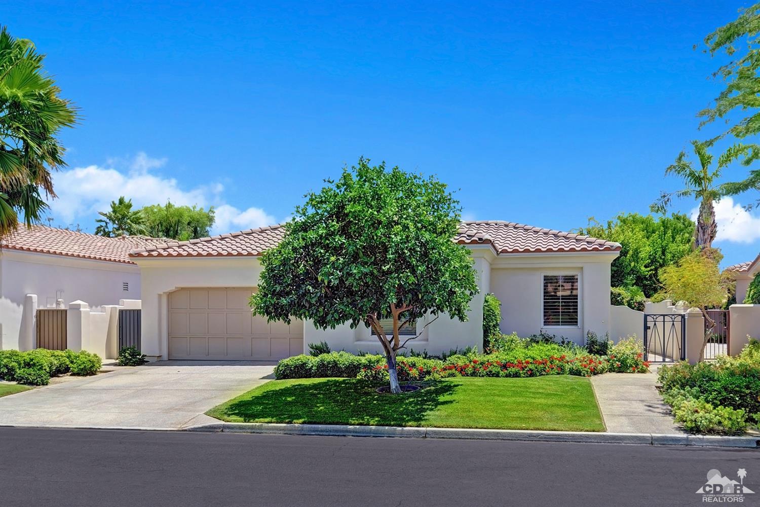 79675 Cetrino La Quinta, CA 92253 - Photo 33 of 34 a front view of a house with a yard and garage