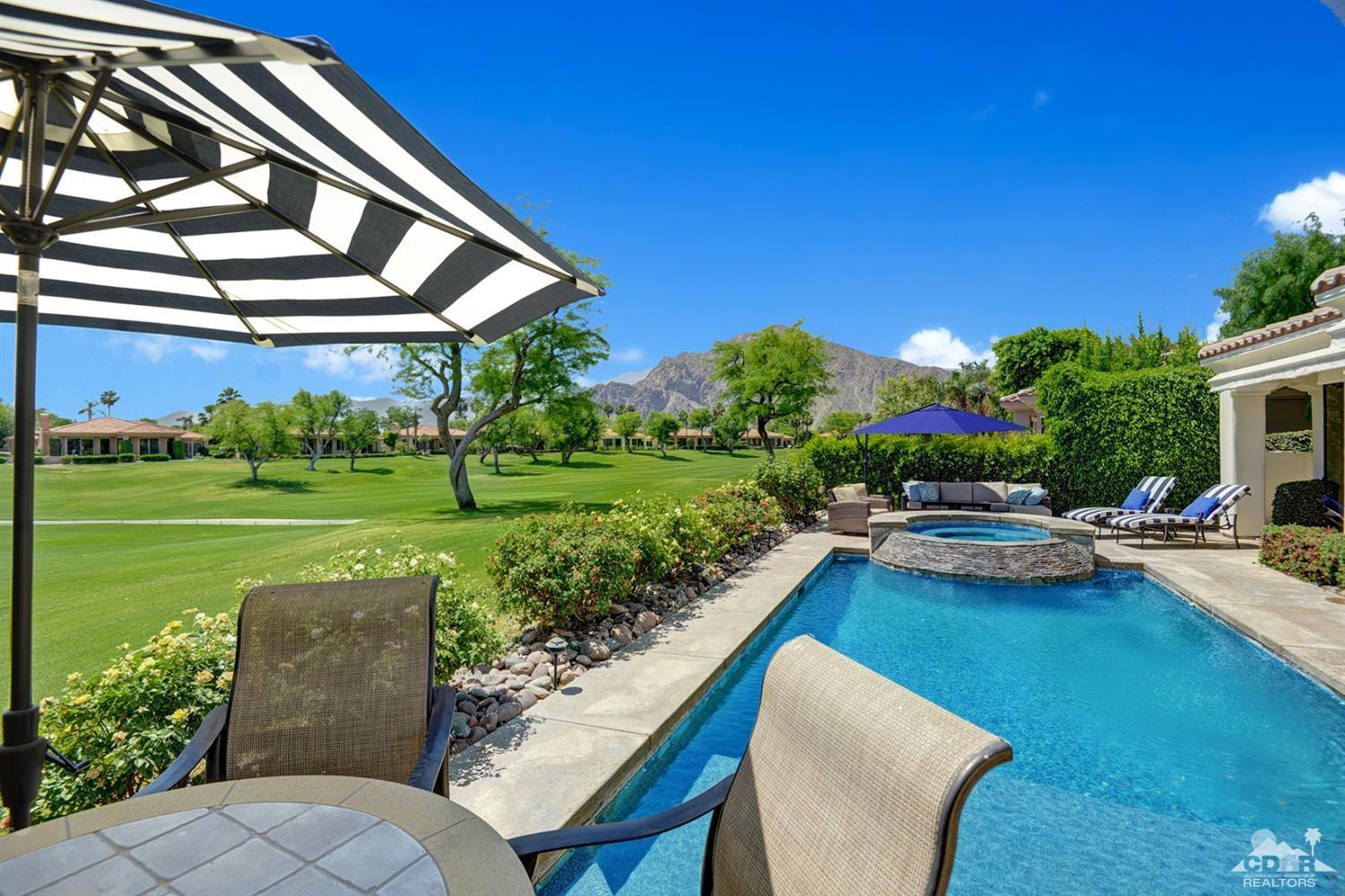 79675 Cetrino La Quinta, CA 92253 - Photo 5 of 34 a view of a house with backyard sitting area and garden