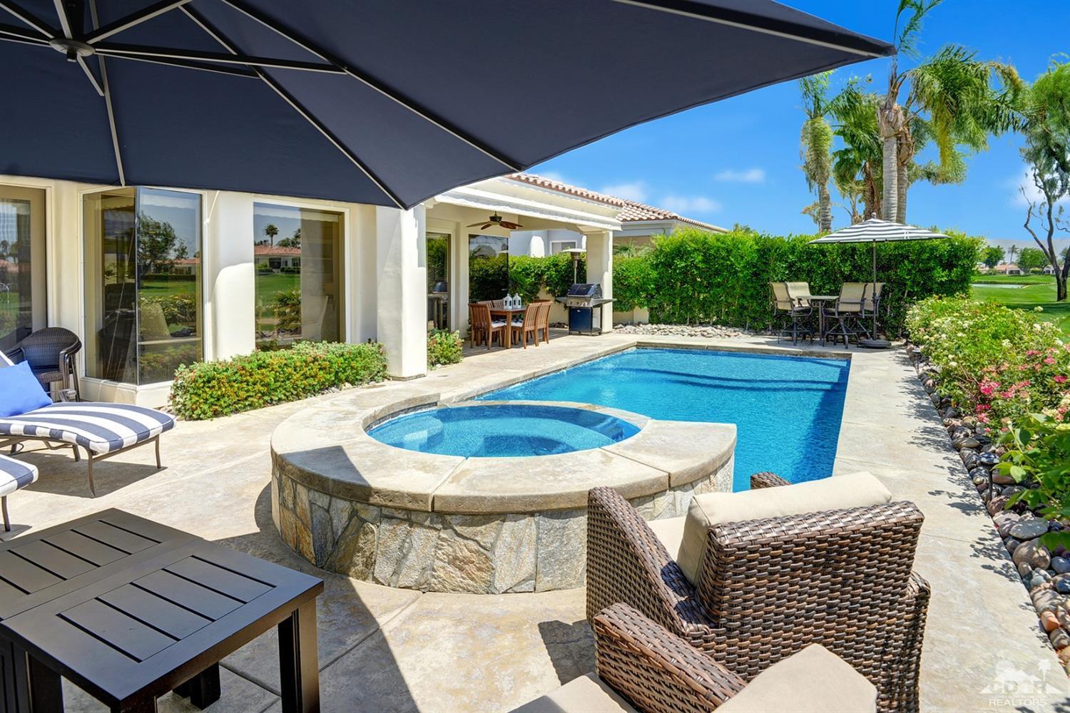 79675 Cetrino La Quinta, CA 92253 - Photo 7 of 34 a view of a patio with table and chairs under an umbrella