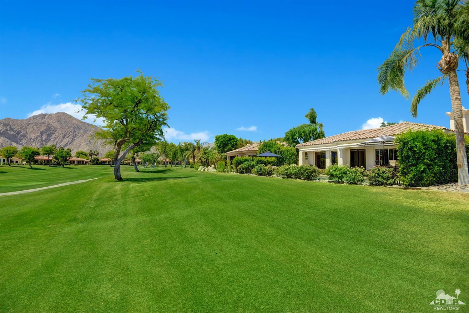 79675 Cetrino La Quinta, CA 92253 - Photo 8 of 34 a front view of a house with garden