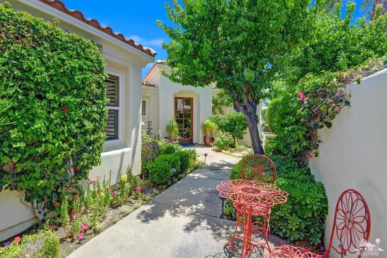 79675 Cetrino La Quinta, CA 92253 - Photo 9 of 34 a front view of a house with garden
