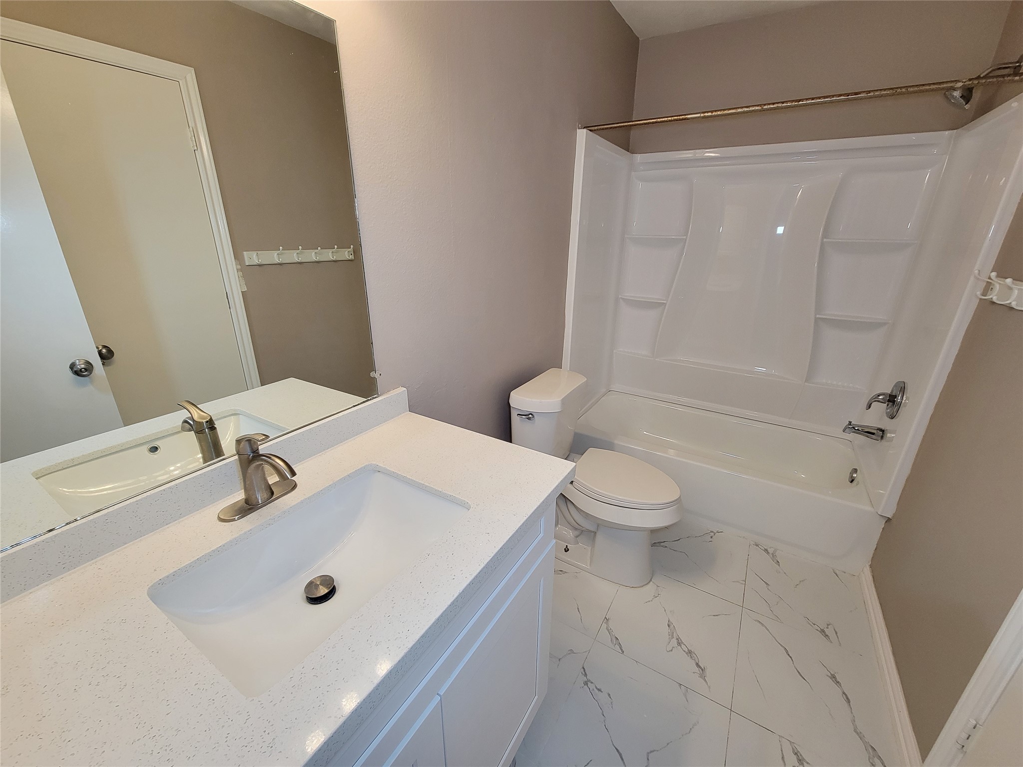 18335 Westlock Street Tomball, TX 77377 - Photo 25 of 38 a bathroom with a sink a toilet and shower