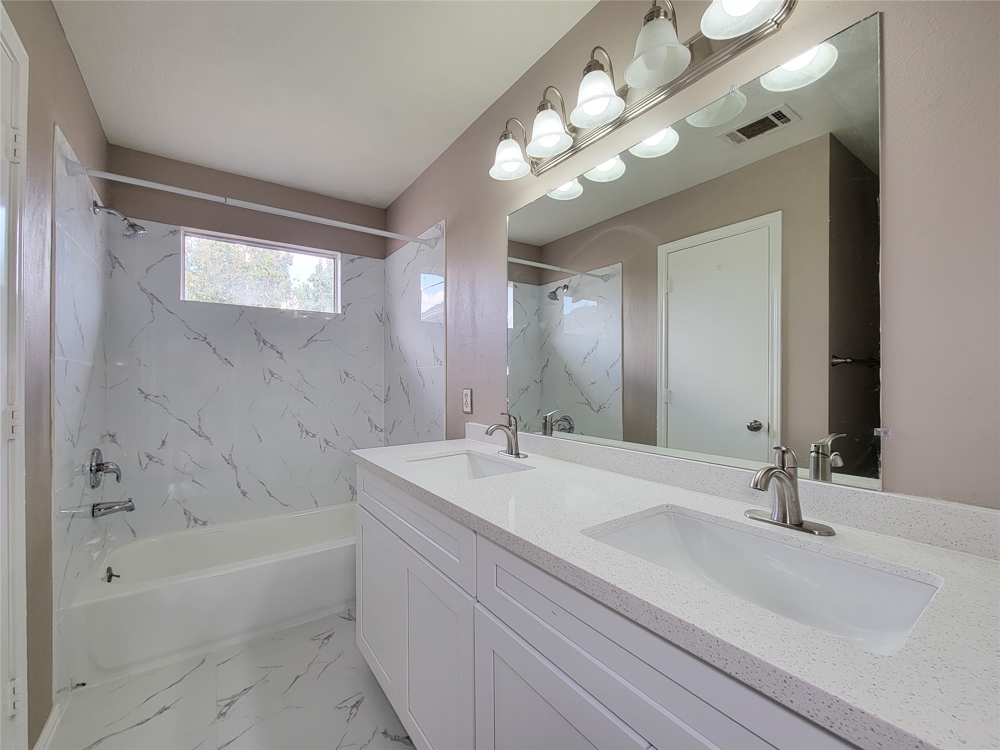 18335 Westlock Street Tomball, TX 77377 - Photo 27 of 38 a bathroom with a bathtub a sink and a mirror