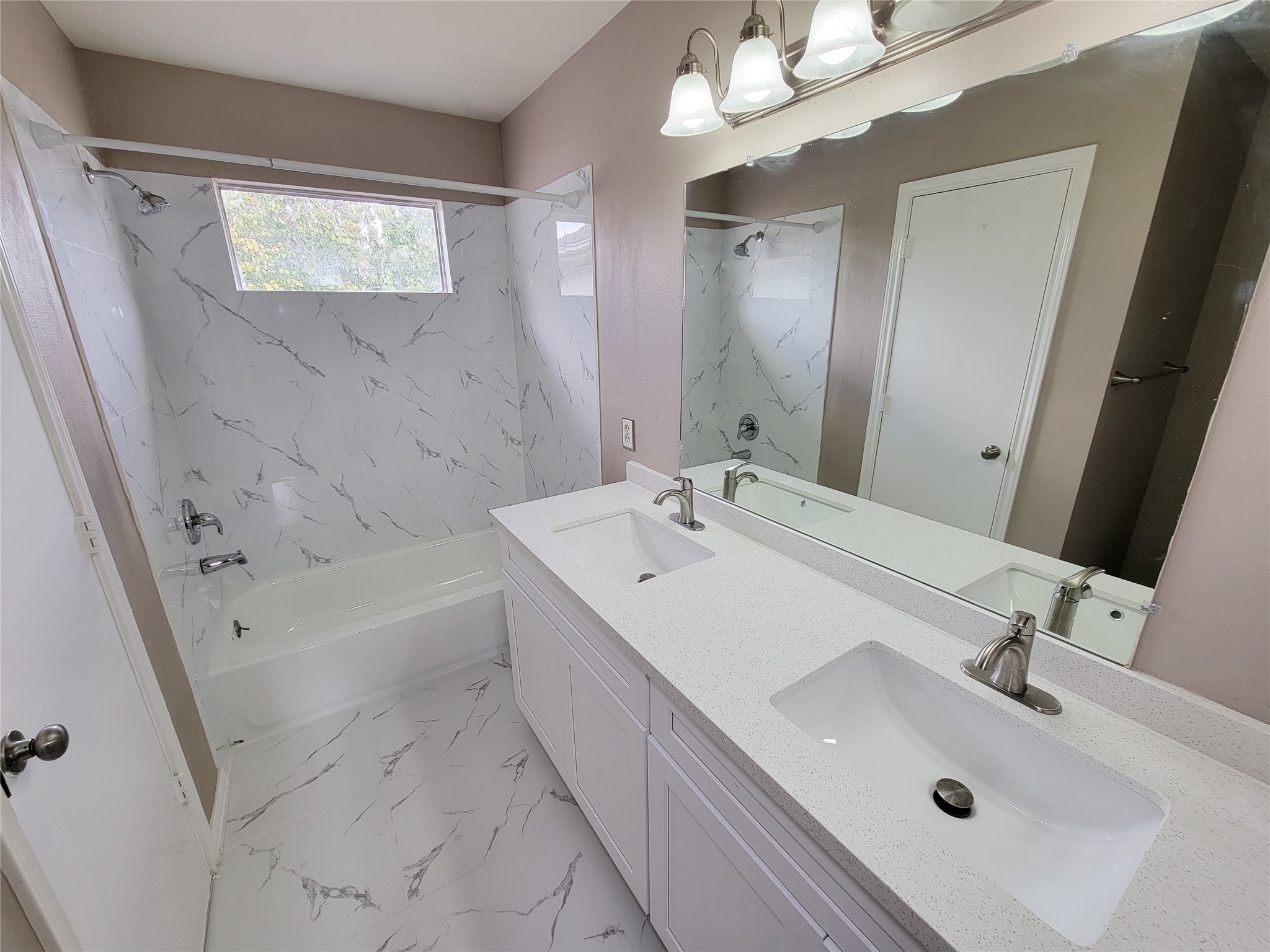 18335 Westlock Street Tomball, TX 77377 - Photo 28 of 38 a bathroom with a sink a tub and a mirror