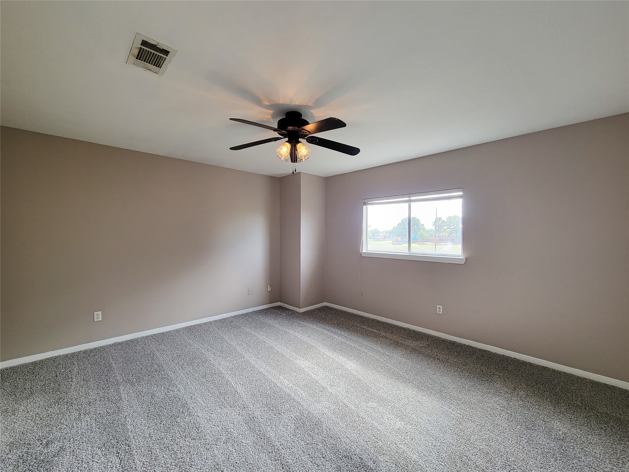 18335 Westlock Street Tomball, TX 77377 - Photo 31 of 38 wooden floor in an empty room with a window