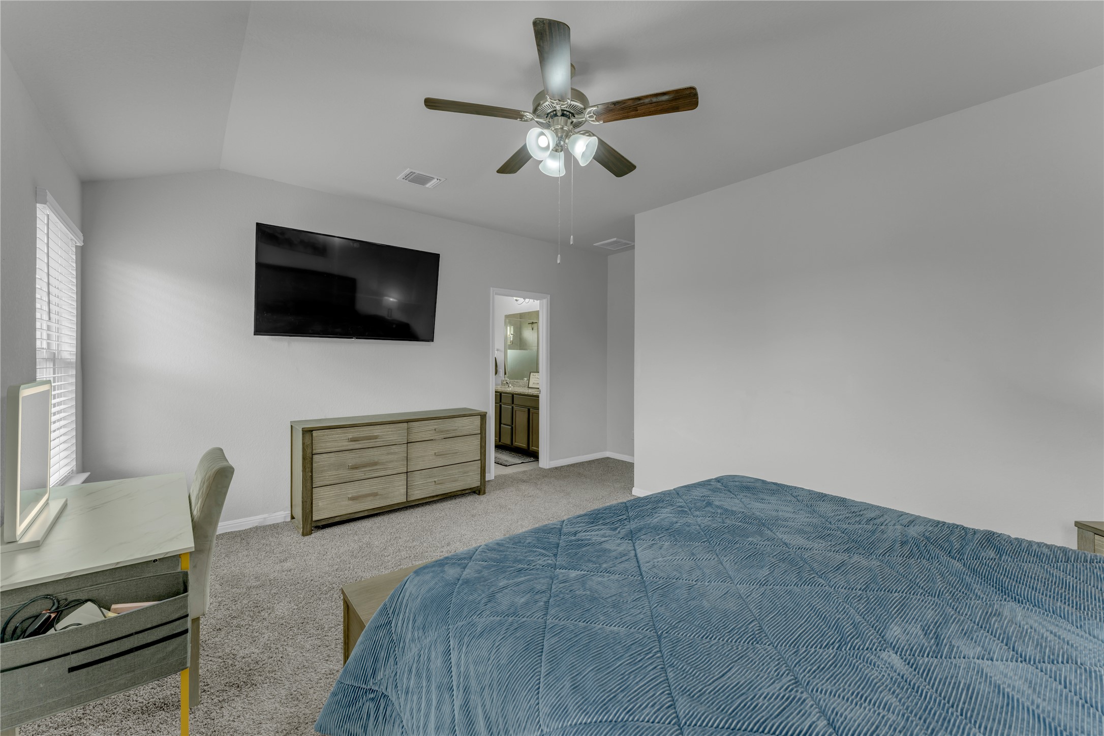132 Cinnamon Loop Burnet, TX 78611 - Photo 12 of 27 Vaulted ceiling with an attached ceiling fan and light fixture
