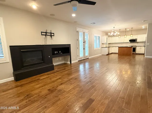 a spacious bathroom with a tub sink and mirror