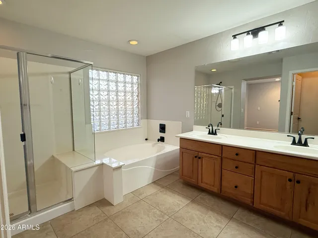 a bathroom with a sink toilet and a mirror