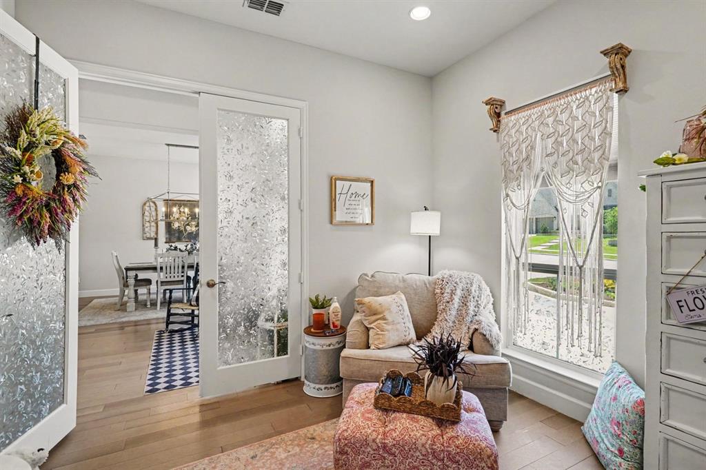 573 Broadleaf Way Haslet, TX 76052 - Photo 13 of 35 a living room with furniture and a floor to ceiling window