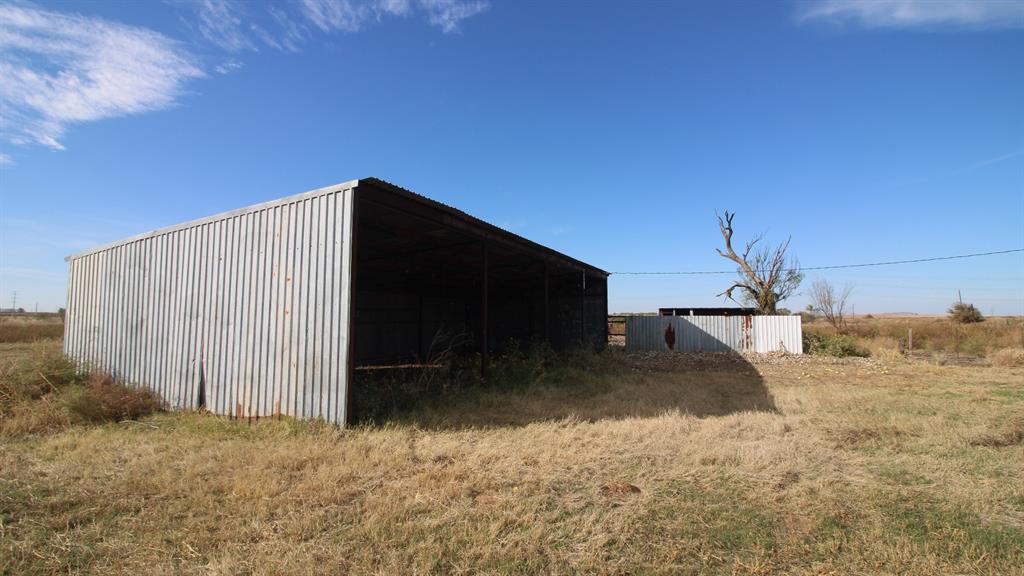 300 County Road 232 Rotan, TX 79546 - Photo 19 of 32 a view of a backyard space