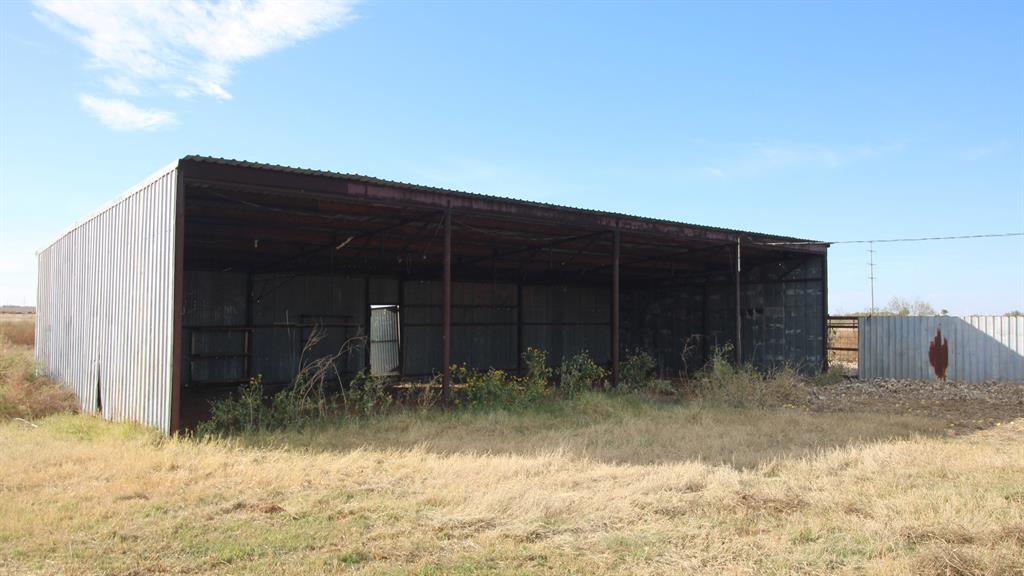 300 County Road 232 Rotan, TX 79546 - Photo 8 of 32 a backyard of a house with yard and seating space
