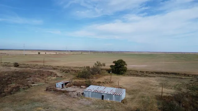 a view of a lake with a yard