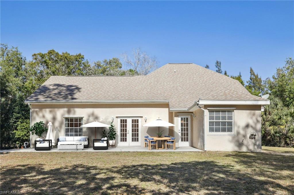 5348 Cypress Lane Naples, FL 34113 - Photo 17 of 28 a view of a house with a patio
