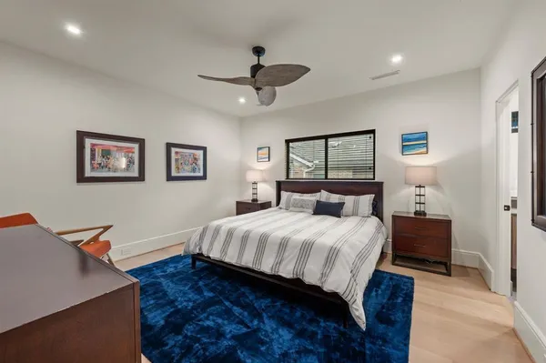 a bedroom with a bed and a desk