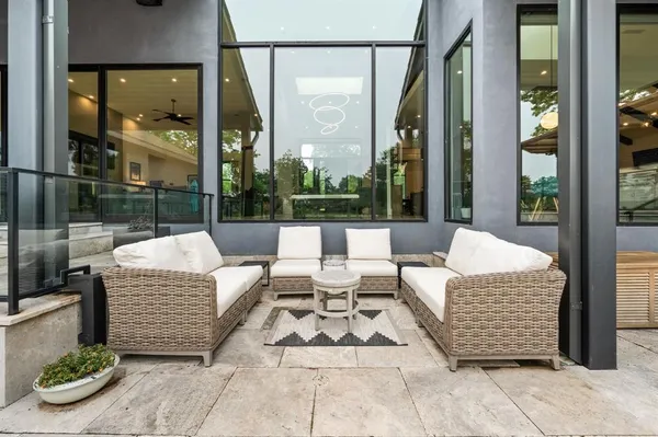 a view of lobby with a couch and glass door