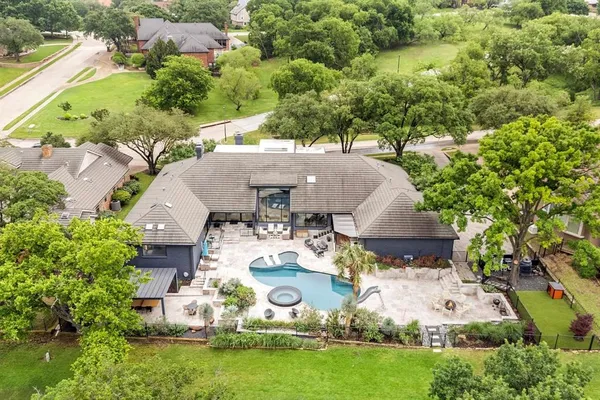 an aerial view of a house with a garden