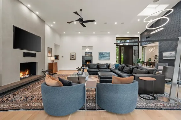 a living room with fireplace furniture and a flat screen tv